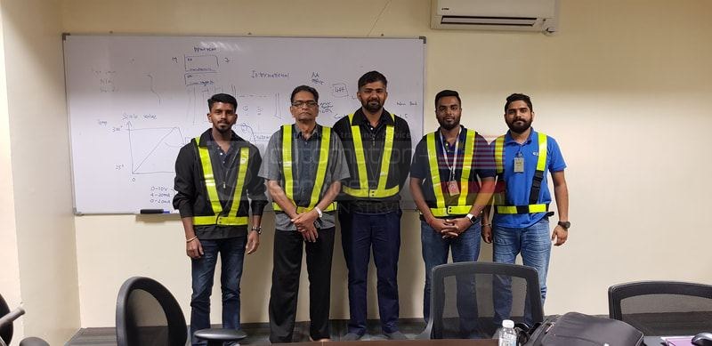 Founder Mr. Sunderasen with graduating Allen Bradley PLC training class holding their certificates